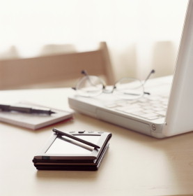 picture of laptop on table with PDA