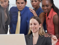 group around a laptop