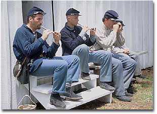 A photo of Union Soldiers playing tin whistles.