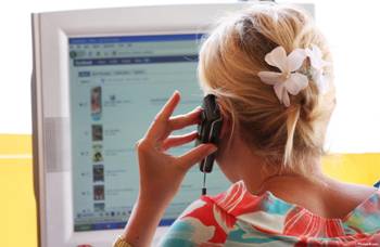 Woman using Computer and Phone